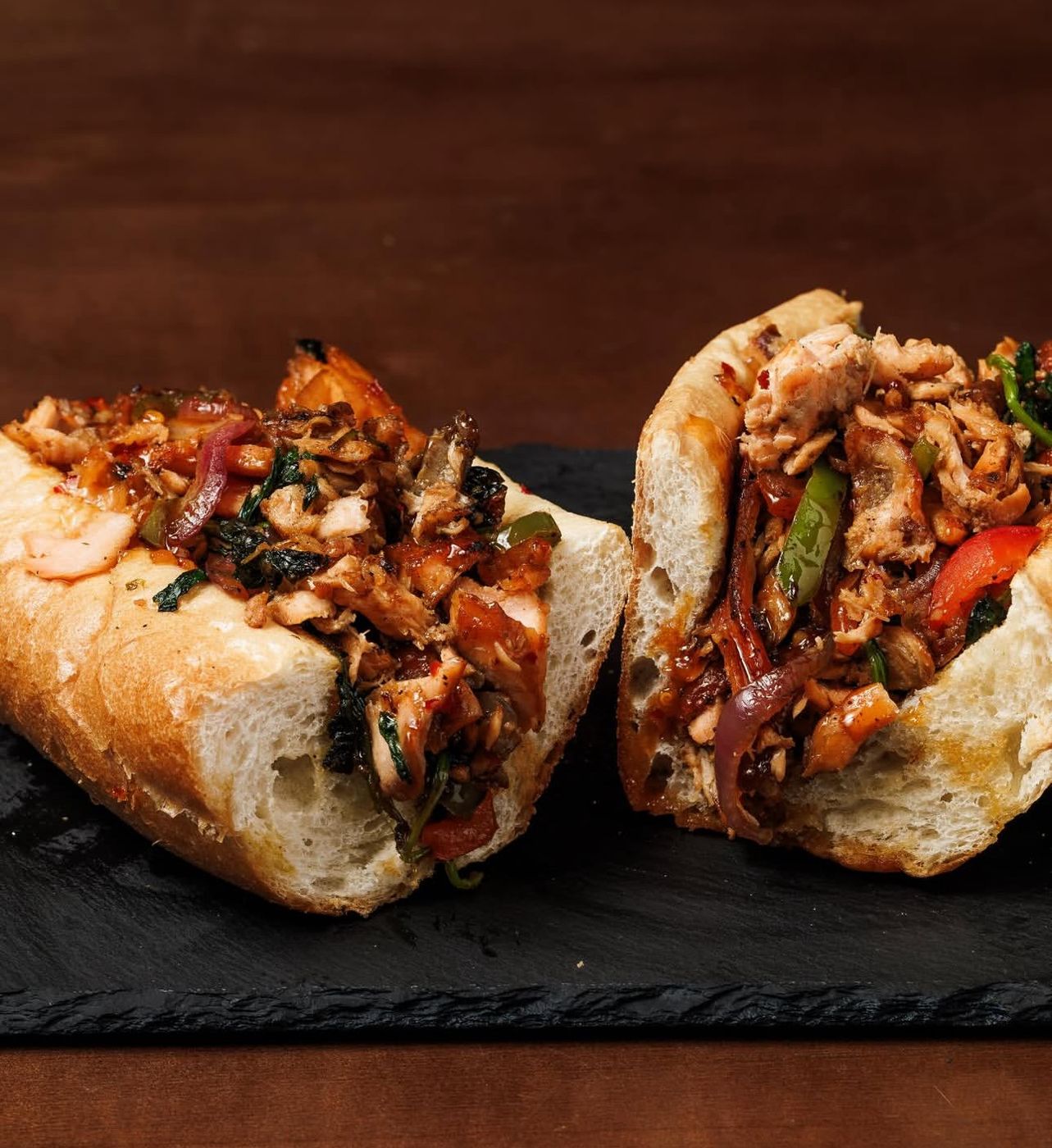 Salmon cheesesteak on a toasted roll